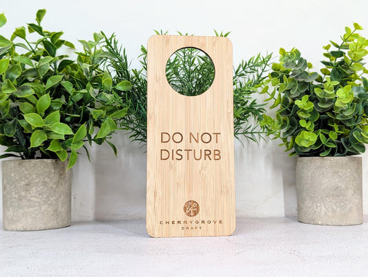 5mm bamboo door hanger reverse side engraved Refresh and Renew, on concrete surface