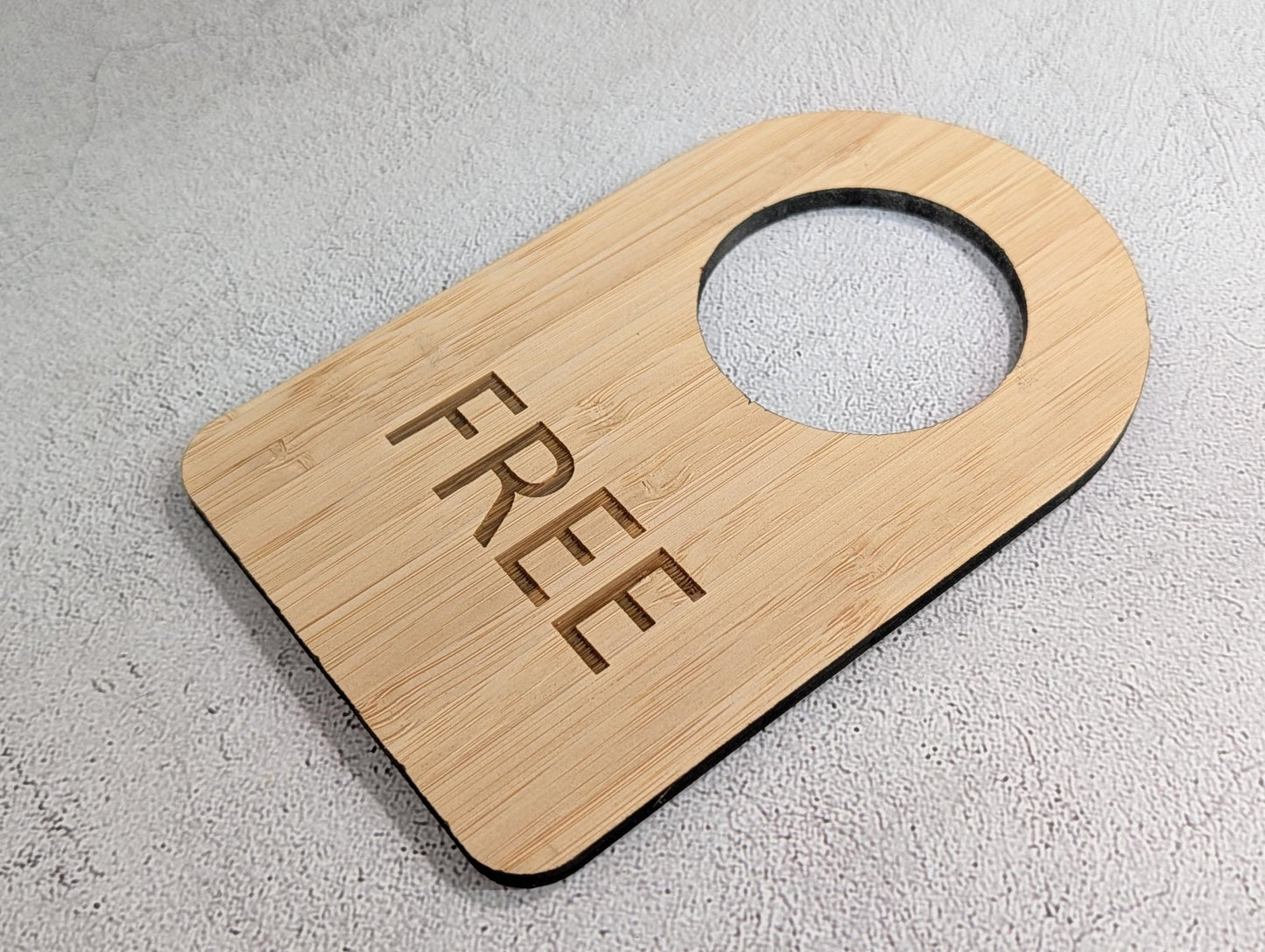 Edge view showing the 5mm thickness of the bamboo door hanger