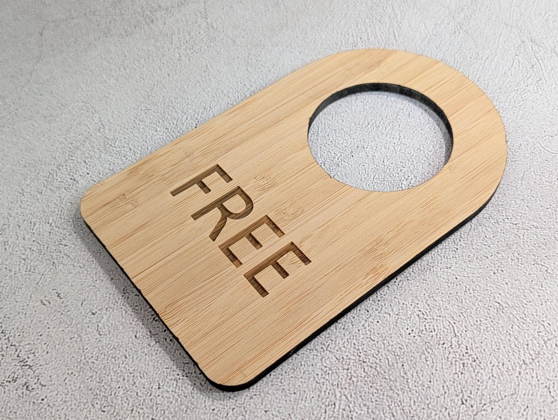 Edge view showing the 5mm thickness of the bamboo door hanger