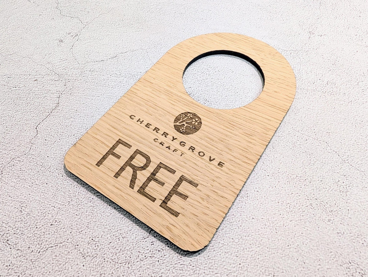In Use / Free logo door hanger — no fixings, slips over a standard door handle