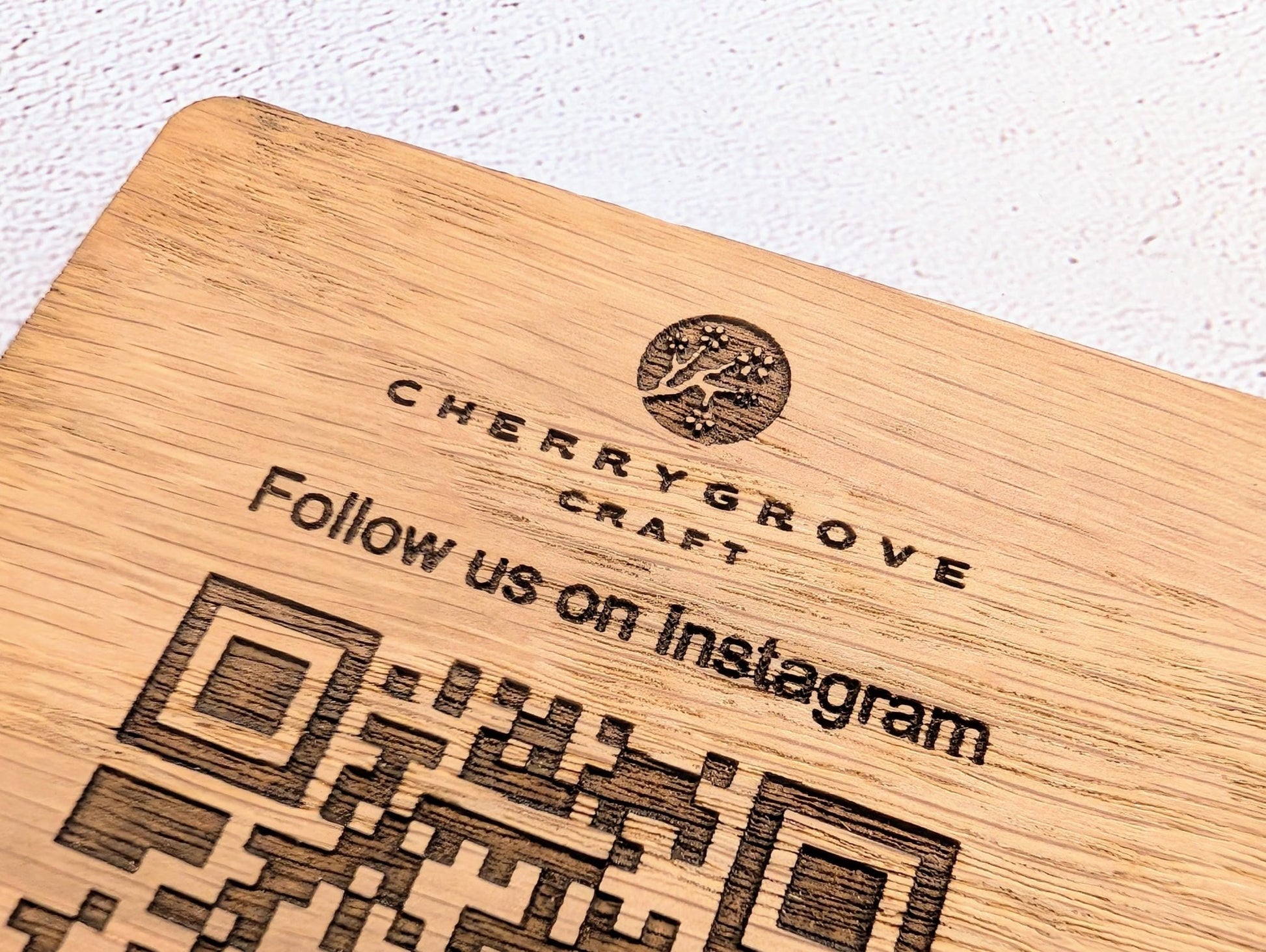 Oak QR code coaster on bar counter — social media marketing tool for cafés and restaurants