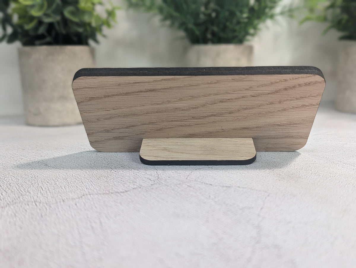 Back of the Instagram QR code stand with the 4mm oak tab slotted in, holding the panel upright