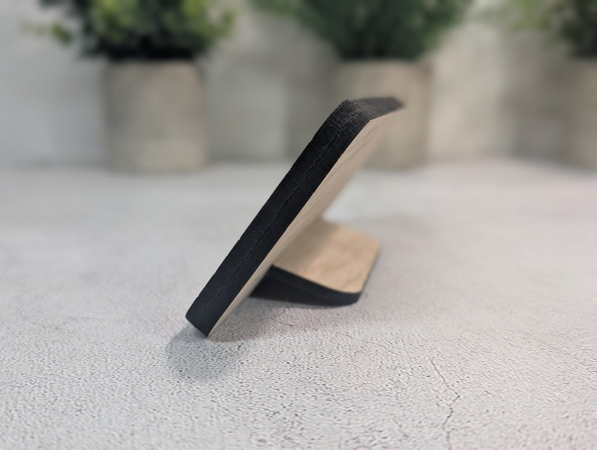 Side view of the Instagram QR code stand: the 8mm two-layer oak panel leaning back on its slot-in tab