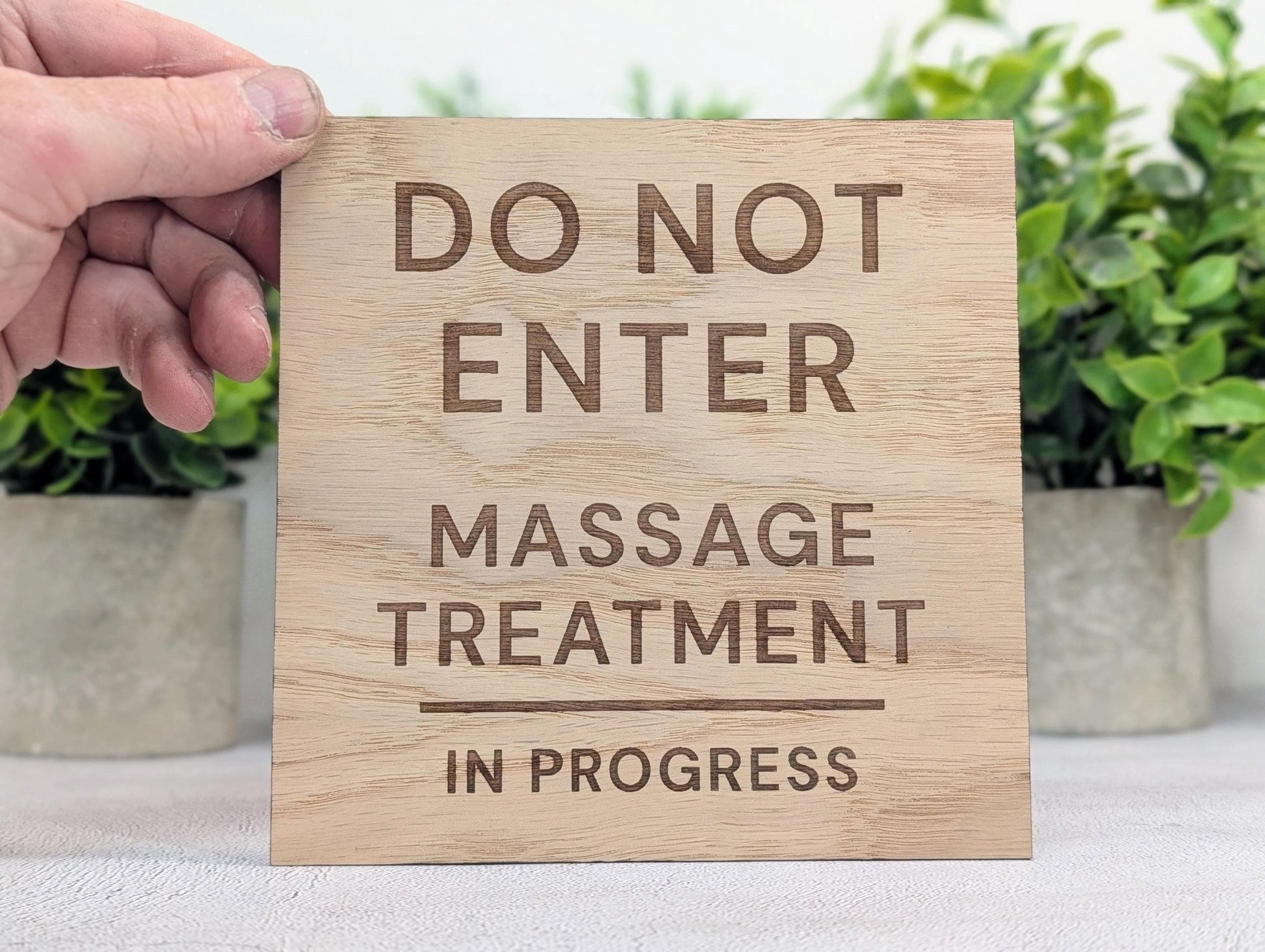 Massage treatment in progress sign — oak veneered MDF, medium square size on therapy room door