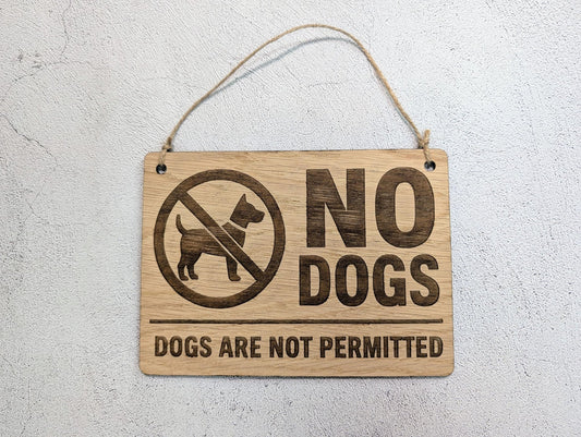 No Dogs Allowed wooden sign hung on natural jute twine
