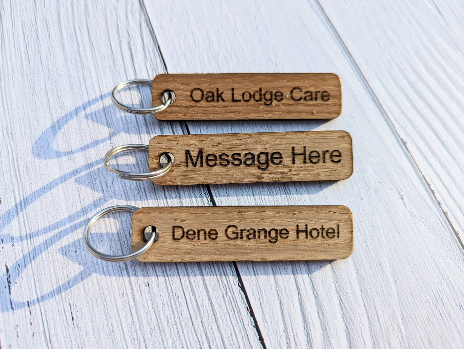 Personalised wooden key tags — oak veneer, single and double-sided options