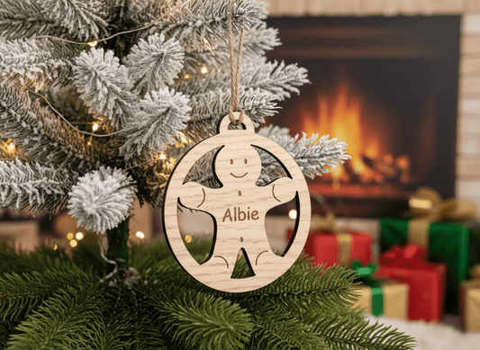 Personalised gingerbread man oak Christmas bauble — FSC-certified oak veneer, laser engraved