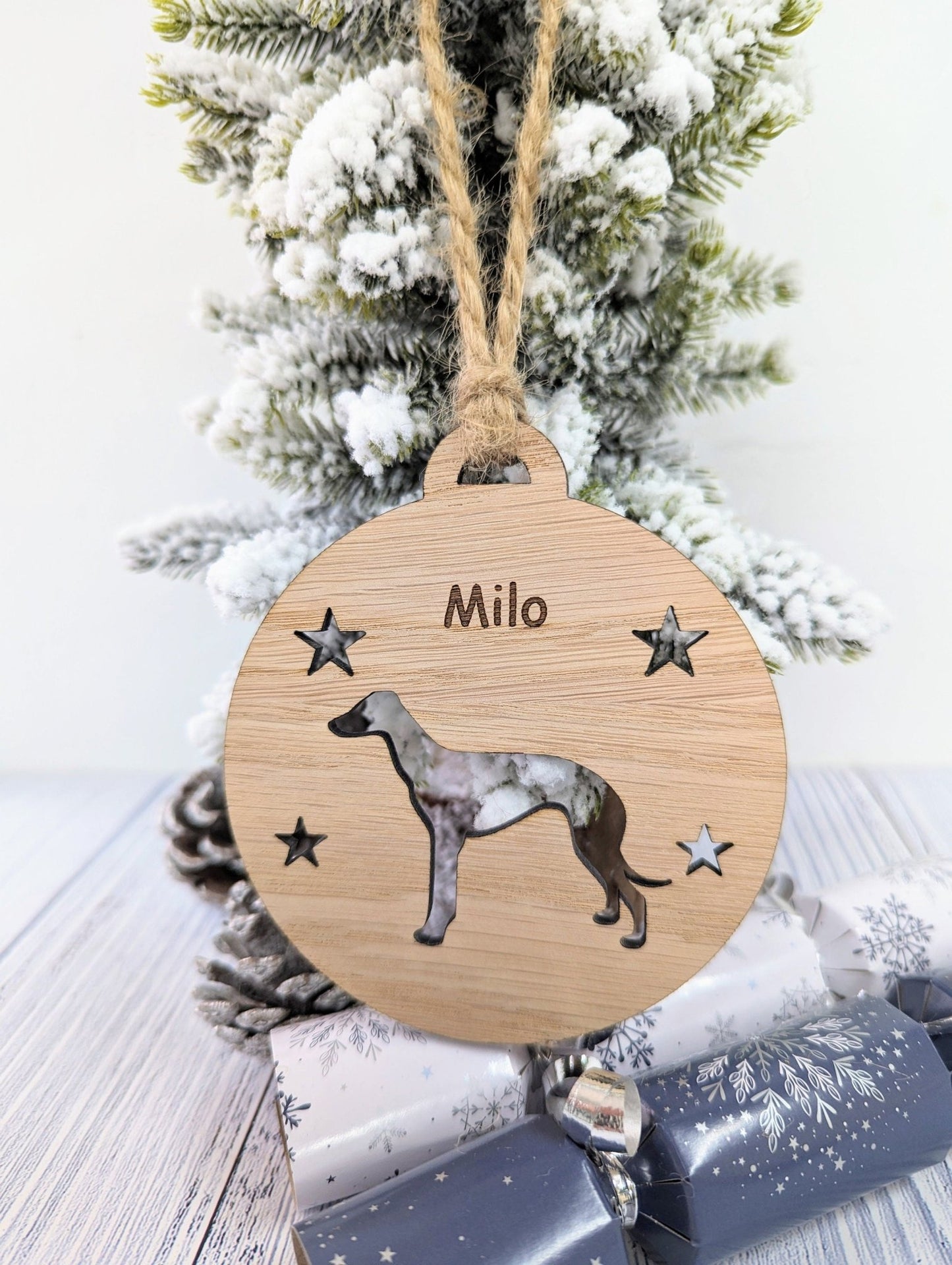 Greyhound bauble reverse — smooth oak veneer, jute string loop