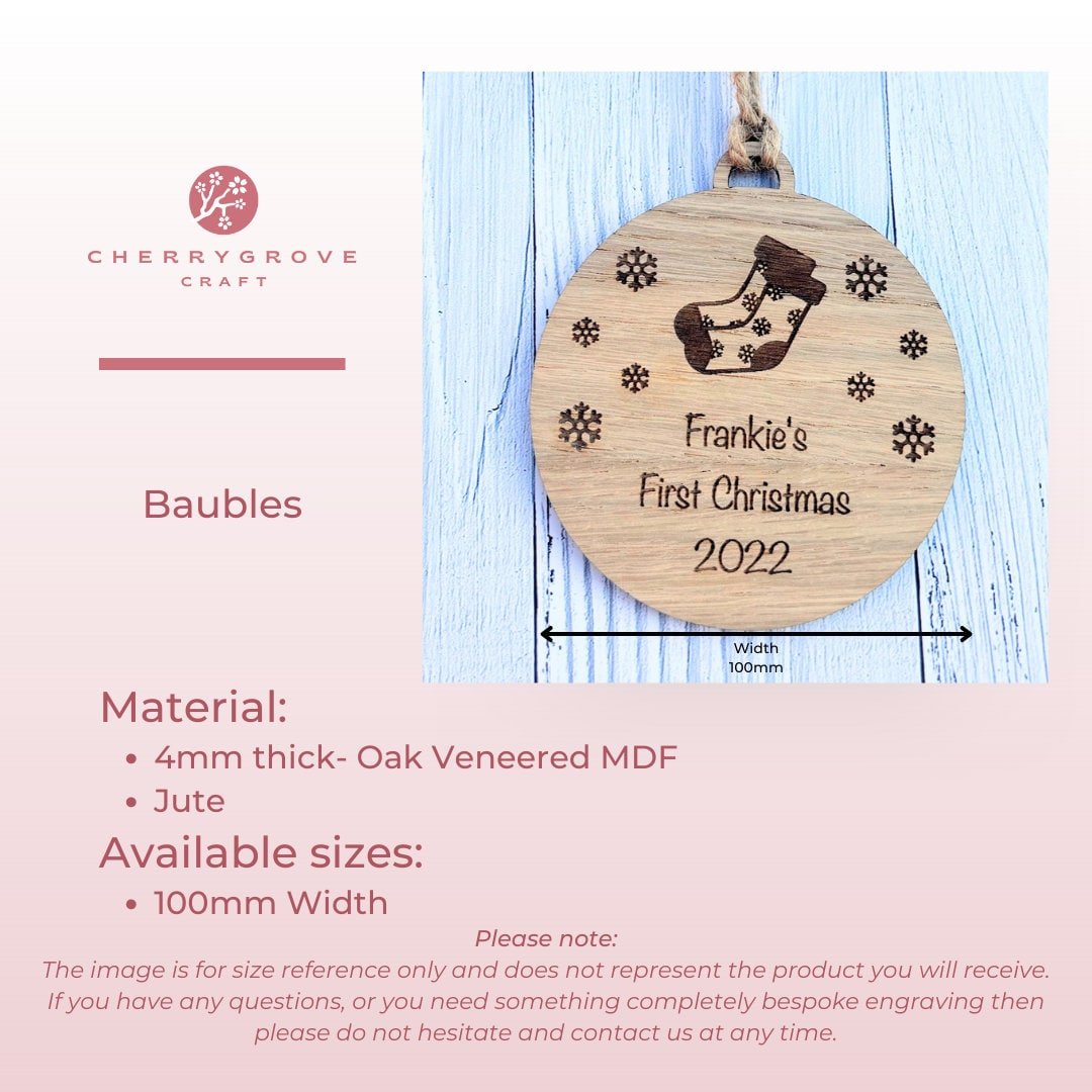 Paw Print bauble close-up — engraved name on oak veneered MDF