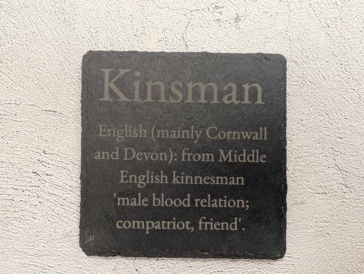 Slate coaster close-up showing laser-engraved lettering detail