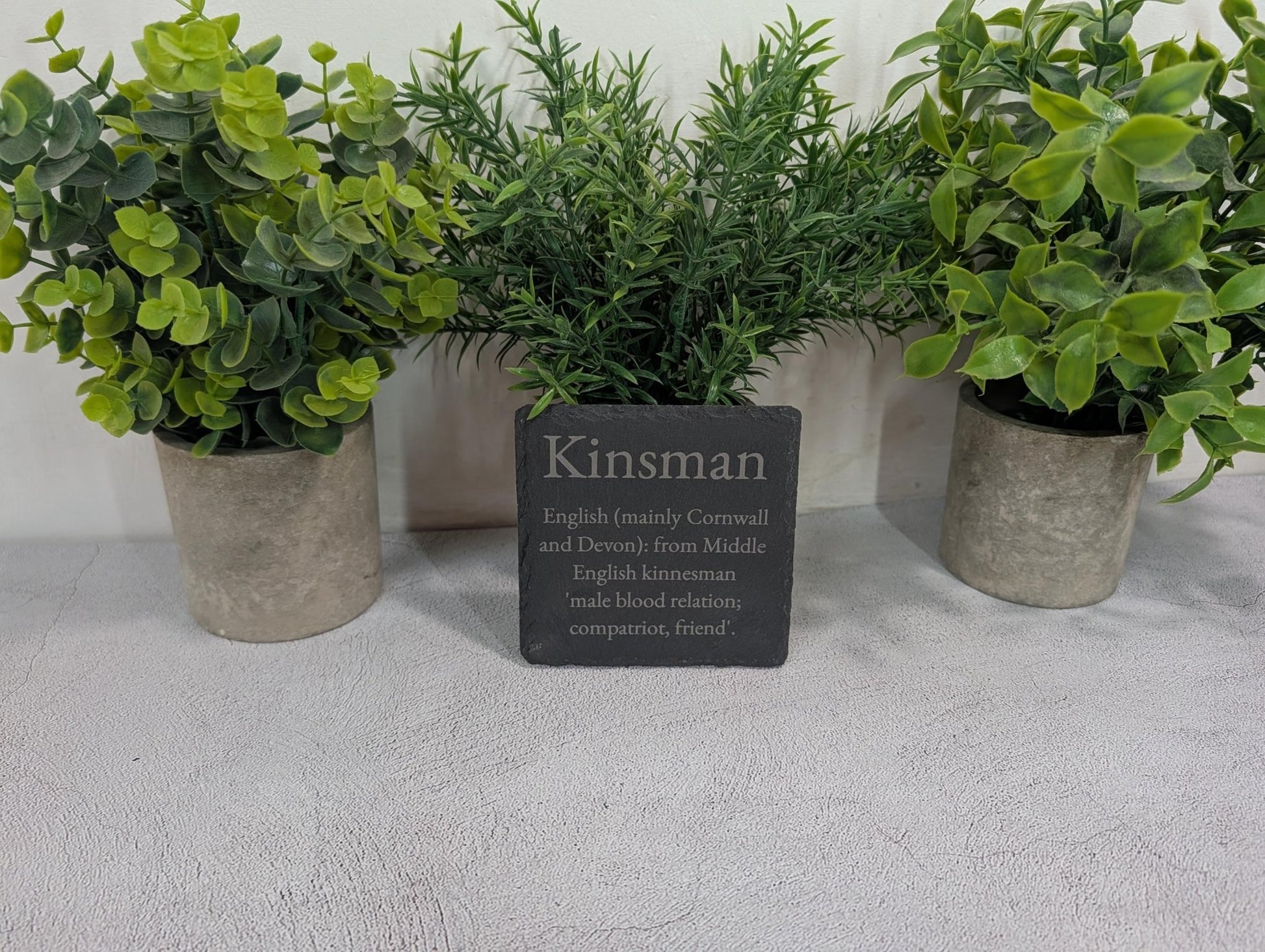 Surname coaster as wedding gift — personalised slate with family name and meaning