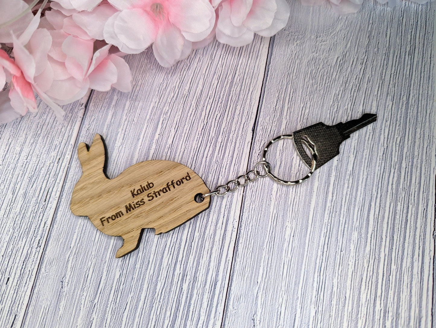 Personalised rabbit oak keyring — cut-out rabbit silhouette with engraved name, 60mm