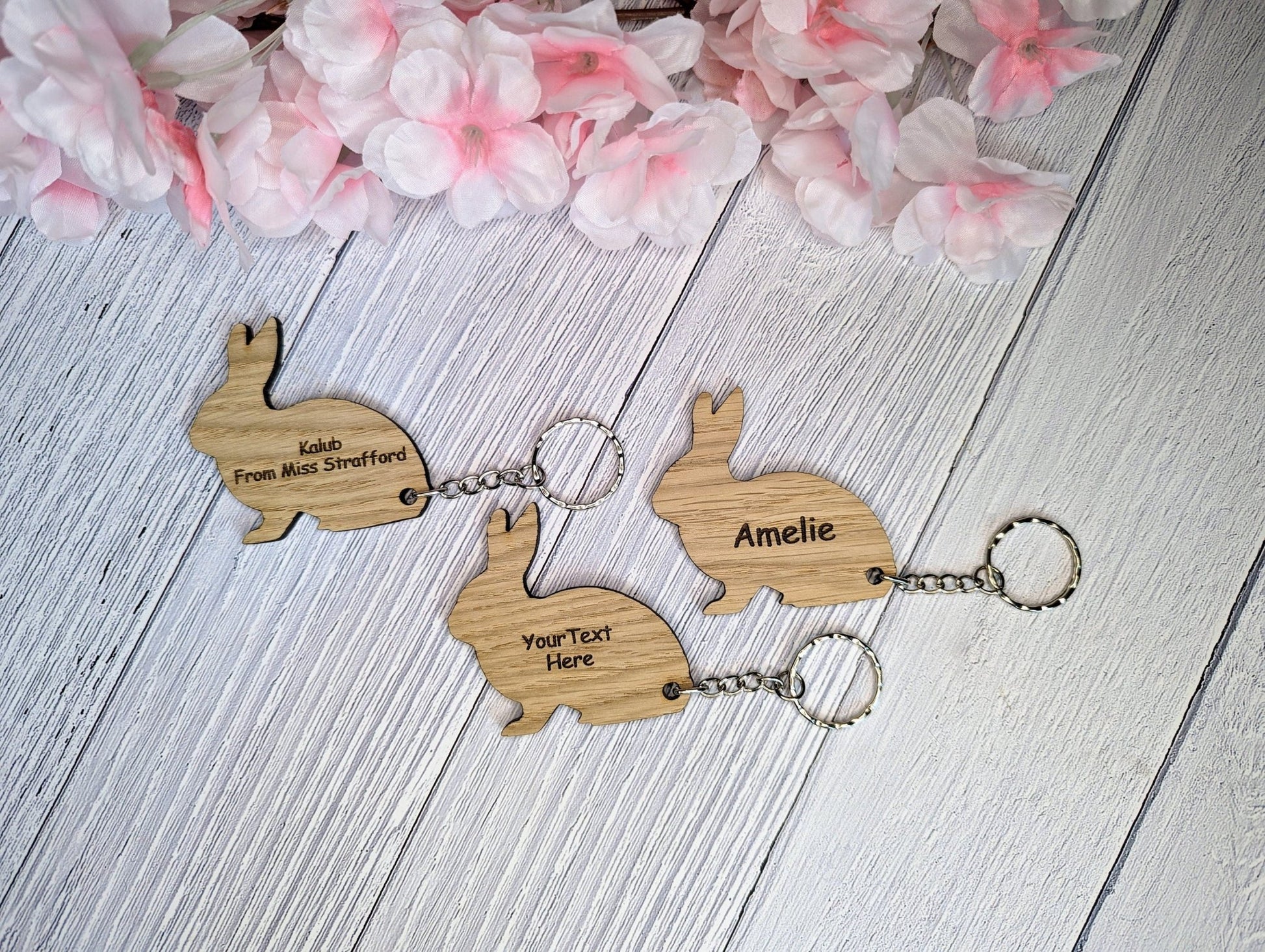 Rabbit keyring showing split ring and chain attachment — 60mm oak