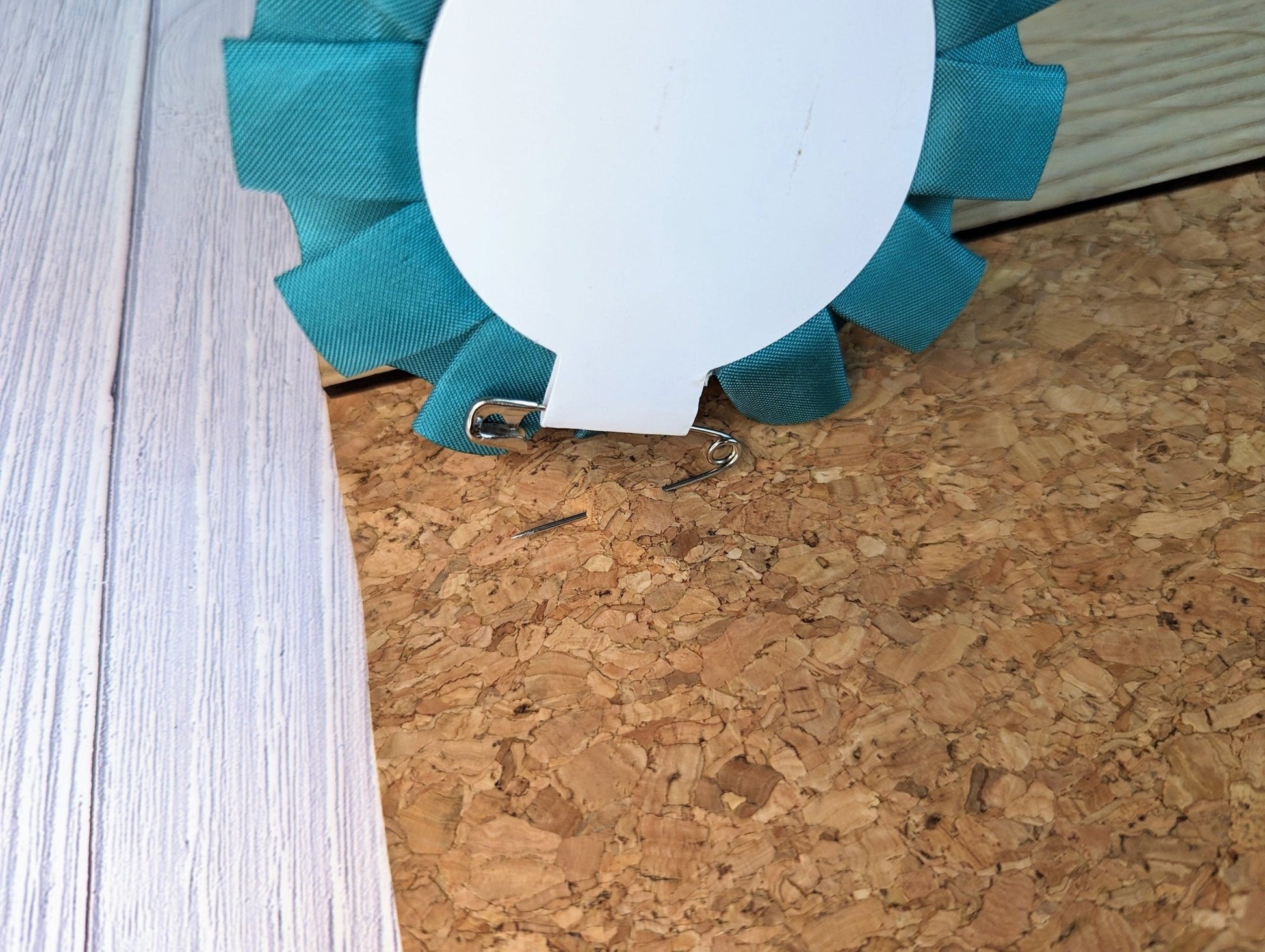 Rosette reverse showing pin attachment — 90mm diameter oak rosette