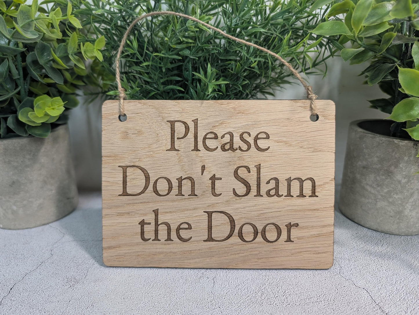 Don't Slam the Door oak sign all four sizes side by side