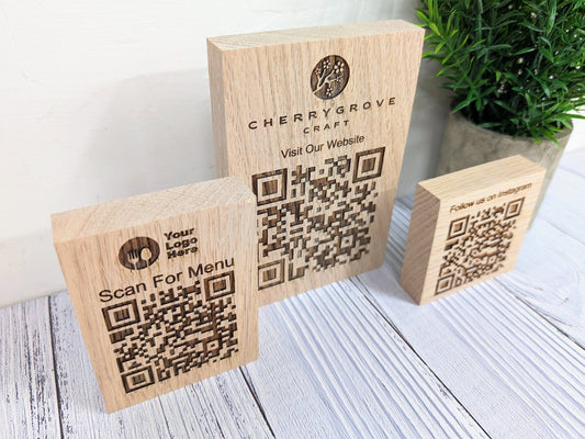 Double-sided QR code block close-up — logo and QR code on both faces