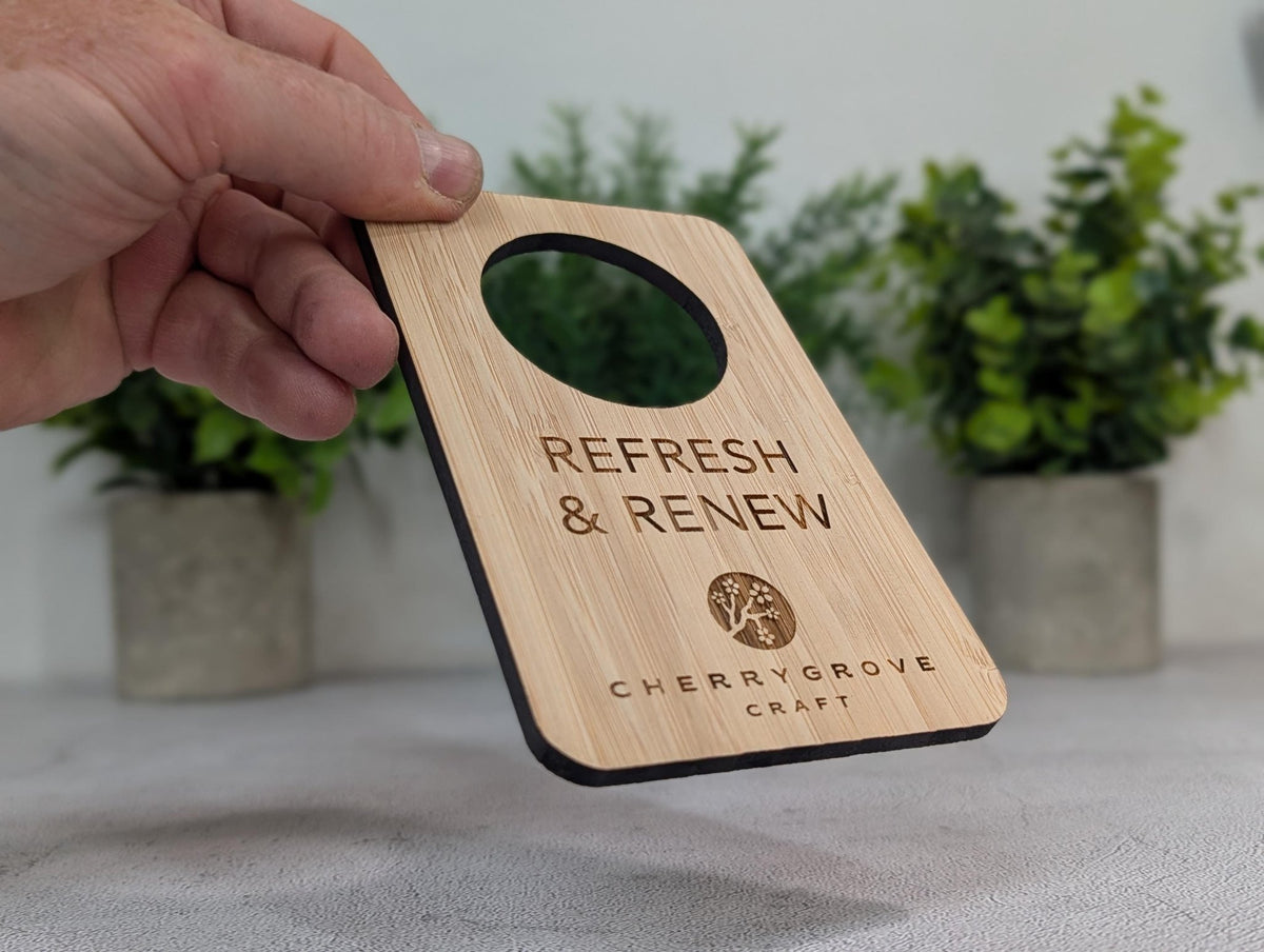 Reversible bamboo door hanger showing the second personalised face