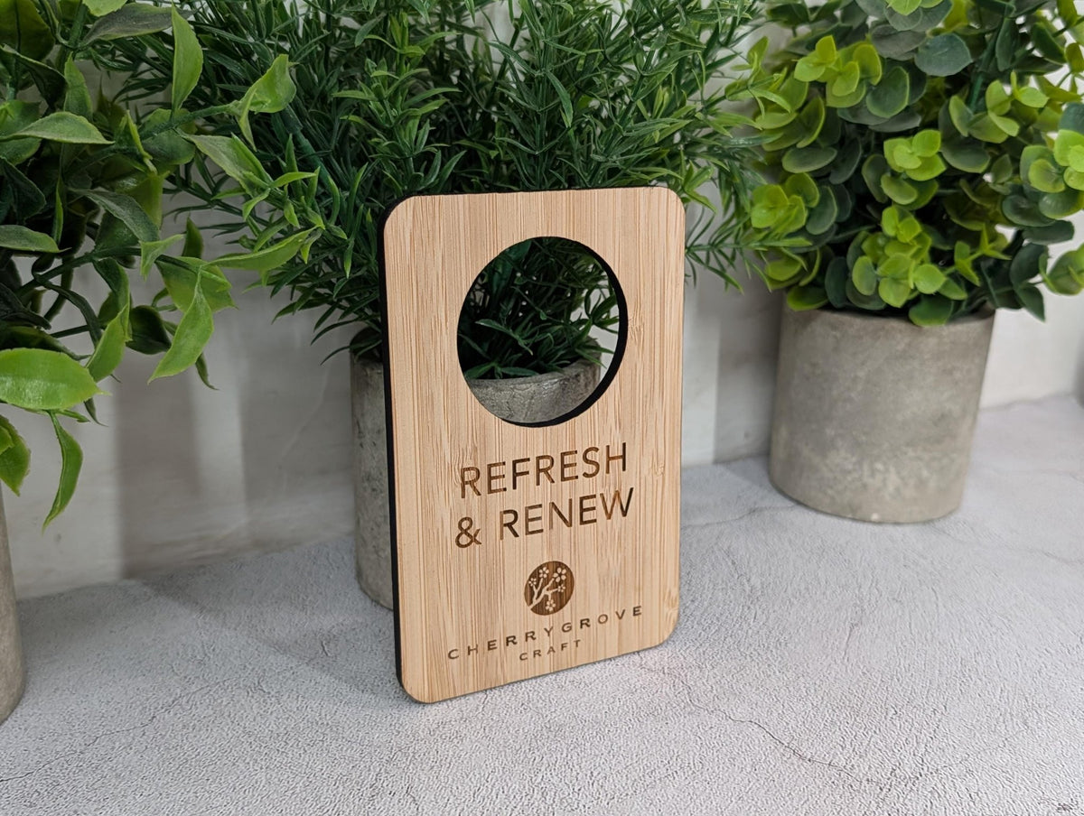 Reversible bamboo door hanger on a hotel guest room handle