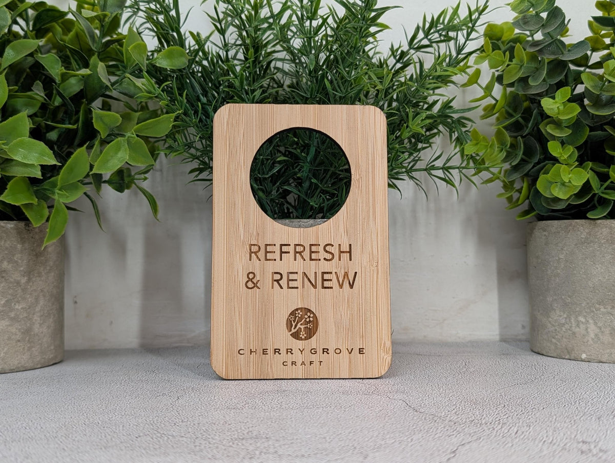 Bamboo door hanger with hotel logo engraved above the wording