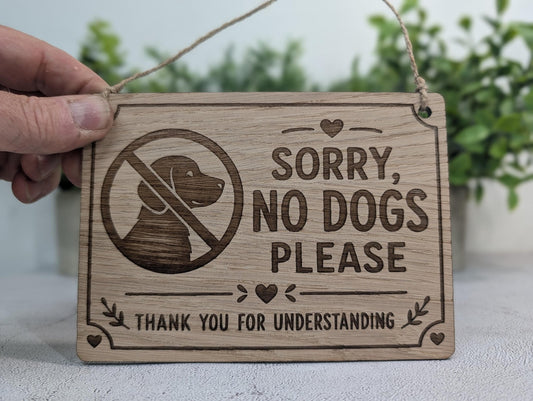 Sorry No Dogs Please polite oak sign with heart-and-leaf border, laser-engraved