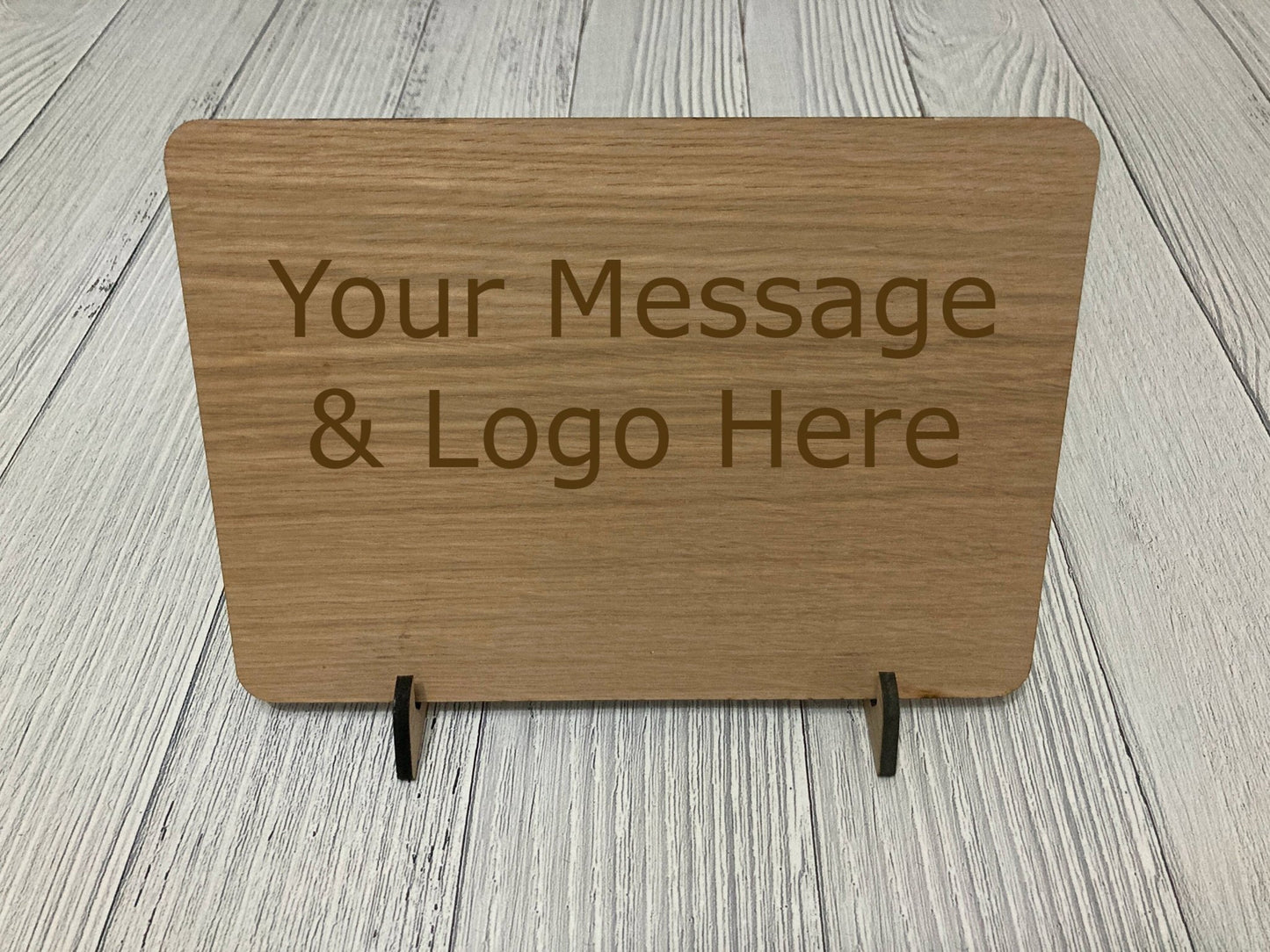 No Shoes No Shirt No Service sign close-up — engraved text on oak veneer
