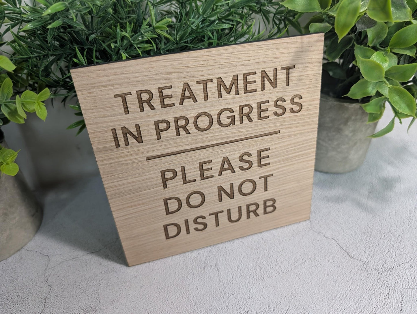 Treatment in Progress sign in salon setting, square oak veneer