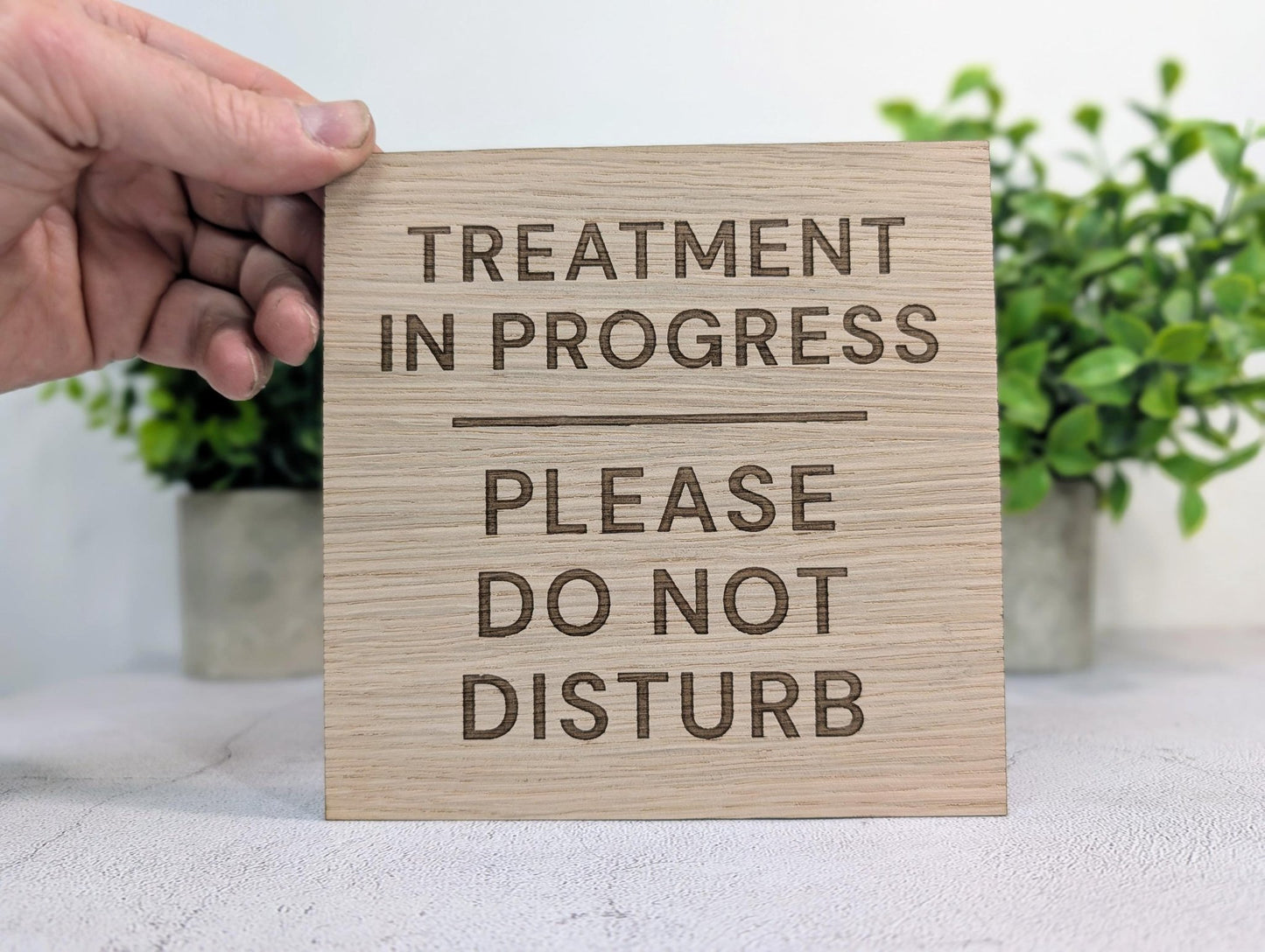 Treatment in Progress oak square sign on therapy room door