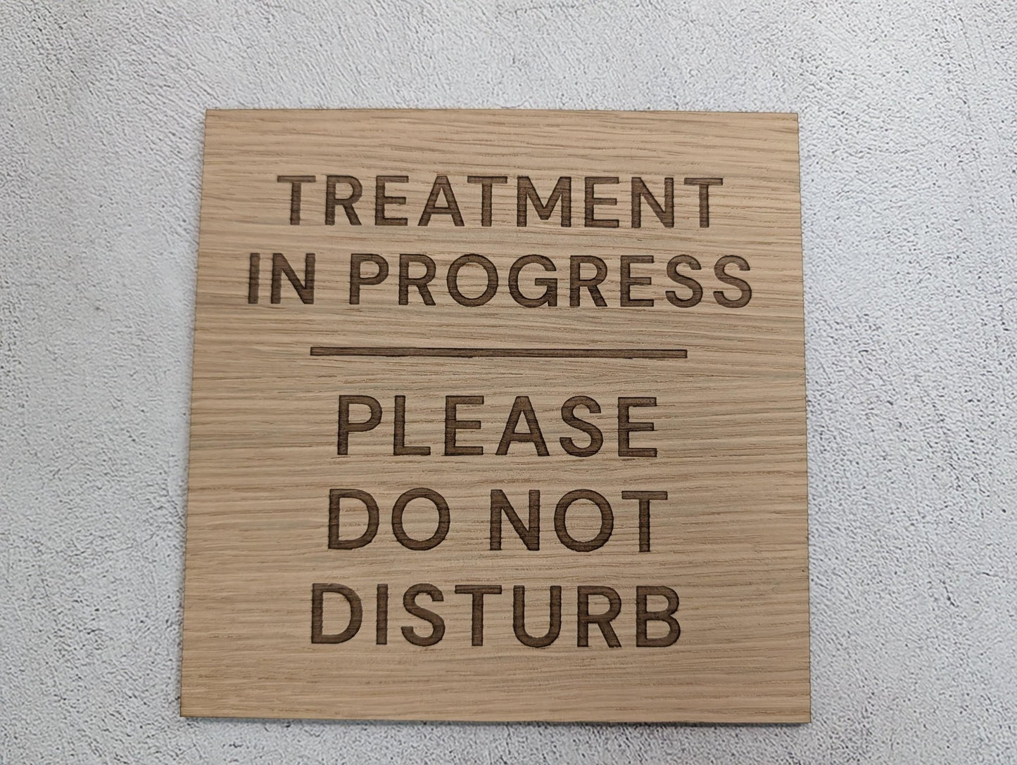 Treatment in Progress sign mounted with adhesive pads, oak veneer
