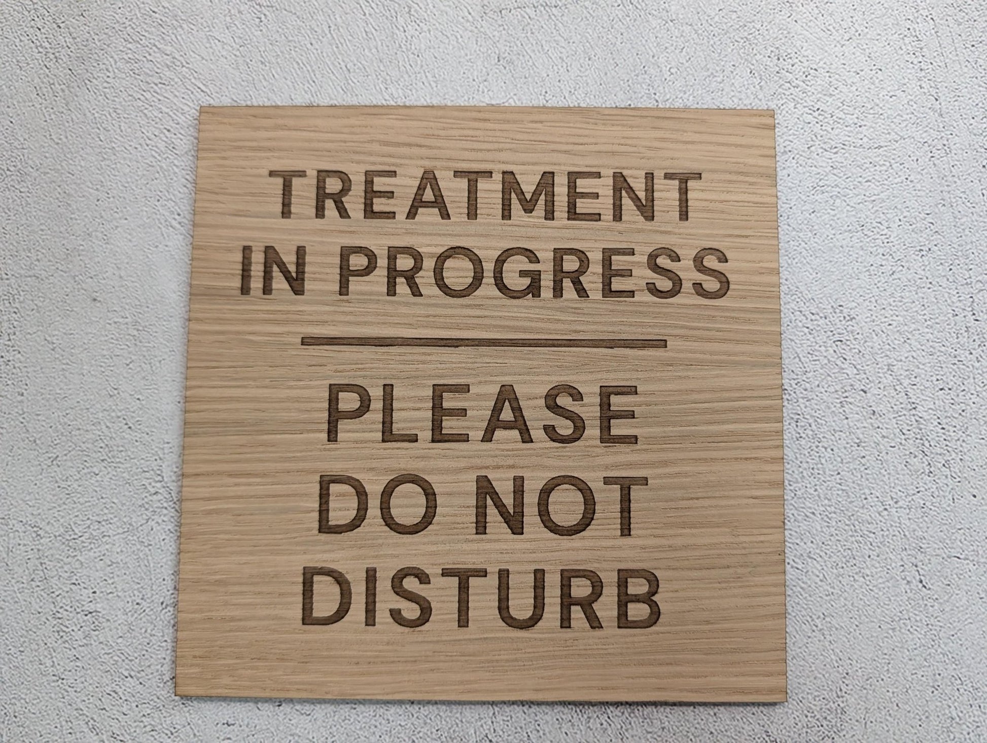 Treatment in Progress sign mounted with adhesive pads, oak veneer